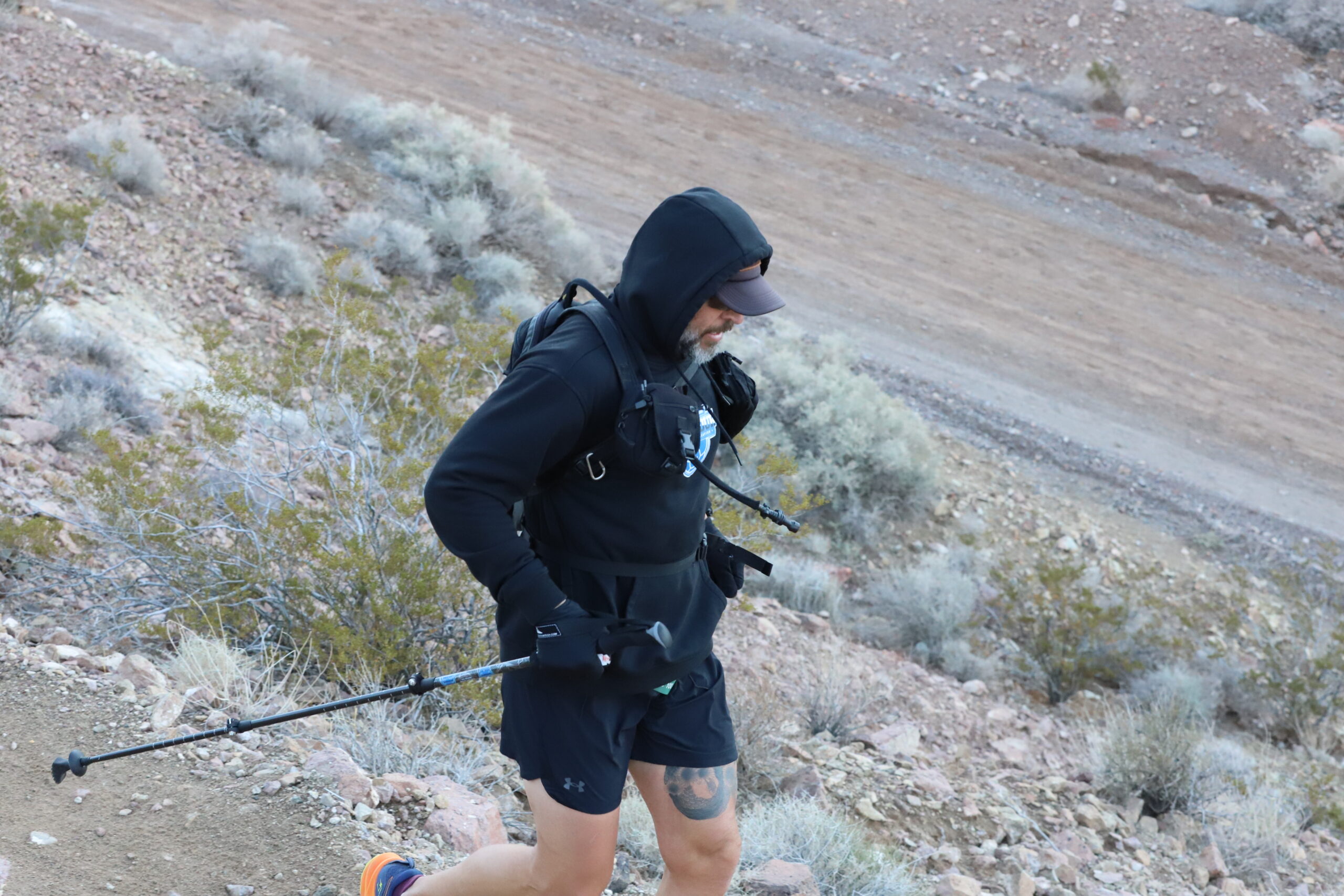 Trail runner running the bootleg boogie in the Mojave desert, Nevada.