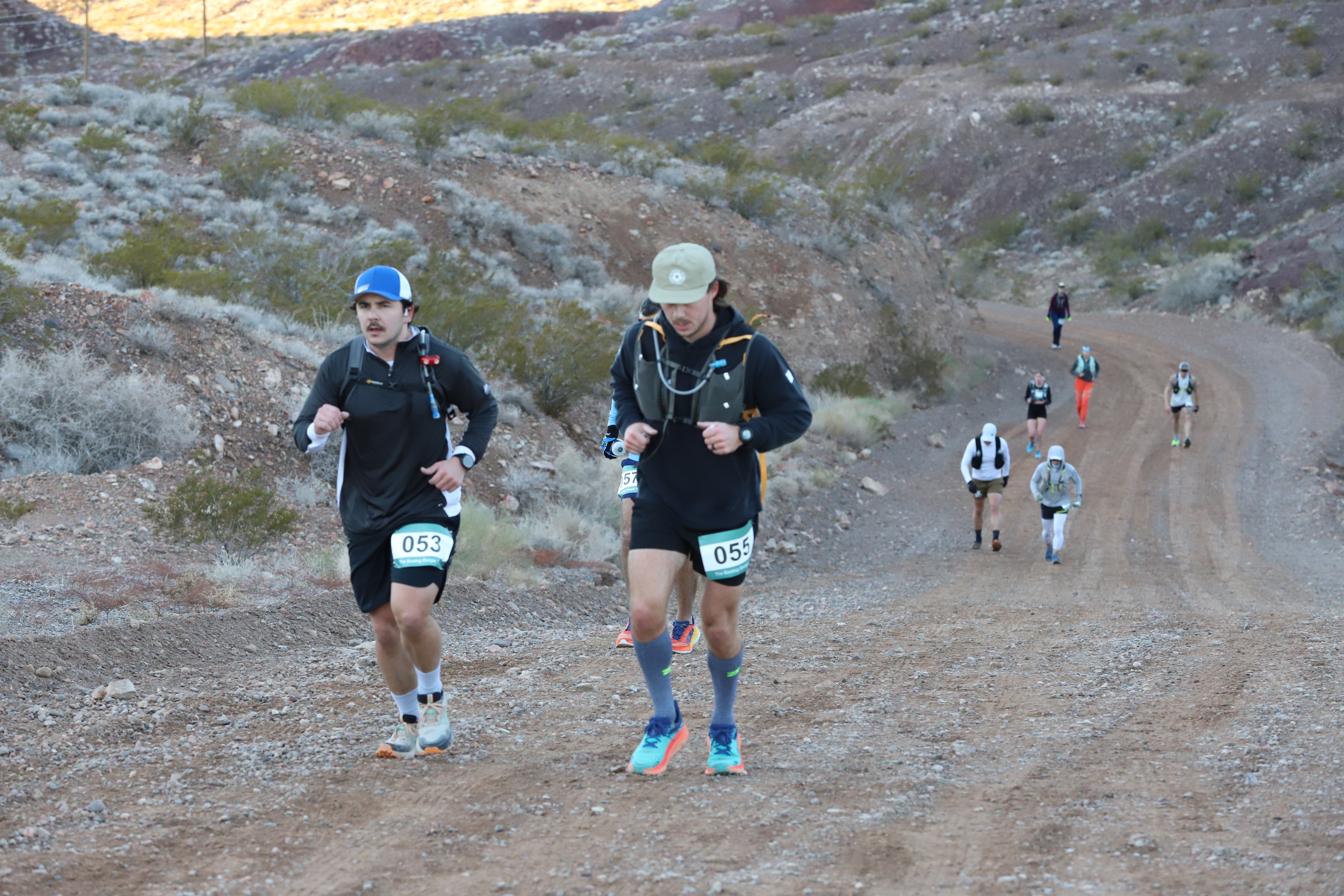 Trail runners running the bootleg boogie in the Mojave desert, Nevada.